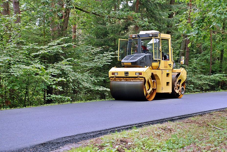 Asphalt roller compacting fresh pavement